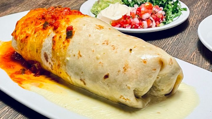 El Patron Restaurante Mexicano signature dishes Burrito GrandeChips and Roasted SalsaGuacamole
